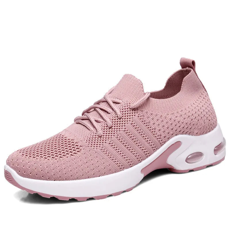Women's solid colour mesh sneakers with round toe and white lace-up front on a grey non-slip PVC sole.