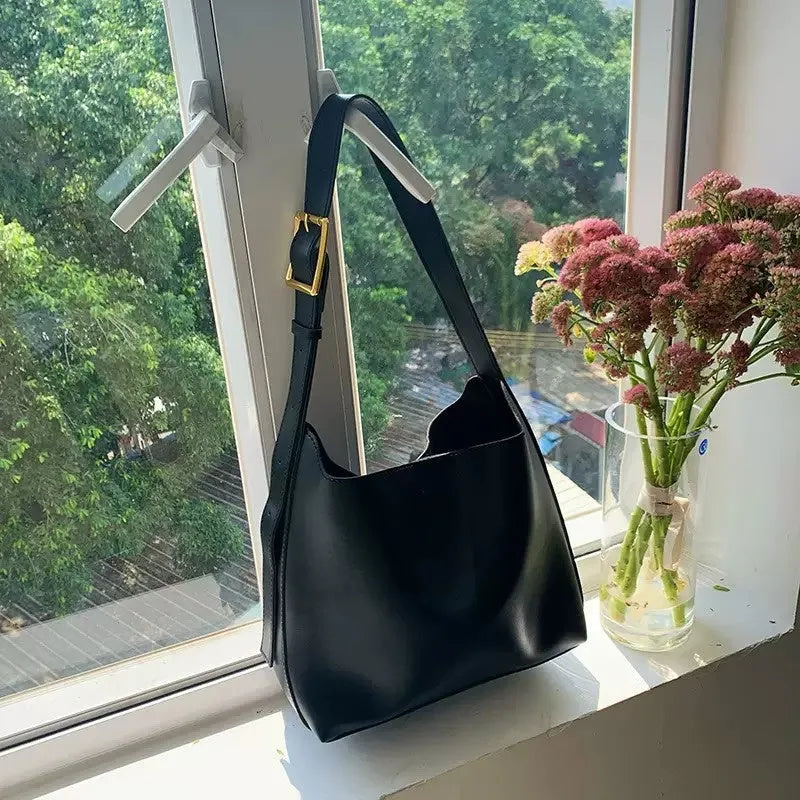 Women's soft PU leather shoulder bag with swinging thread decoration in 28x32x12cm size
