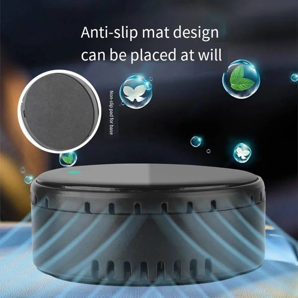 A black solar-powered car air humidifier mounted on a vehicle's air conditioning vent.