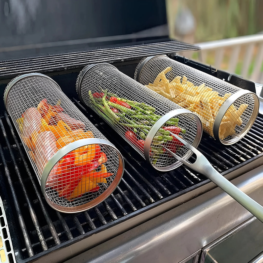 Rolling grill basket metal mesh cylinder with hooks on barbecue, containing vegetables and meat