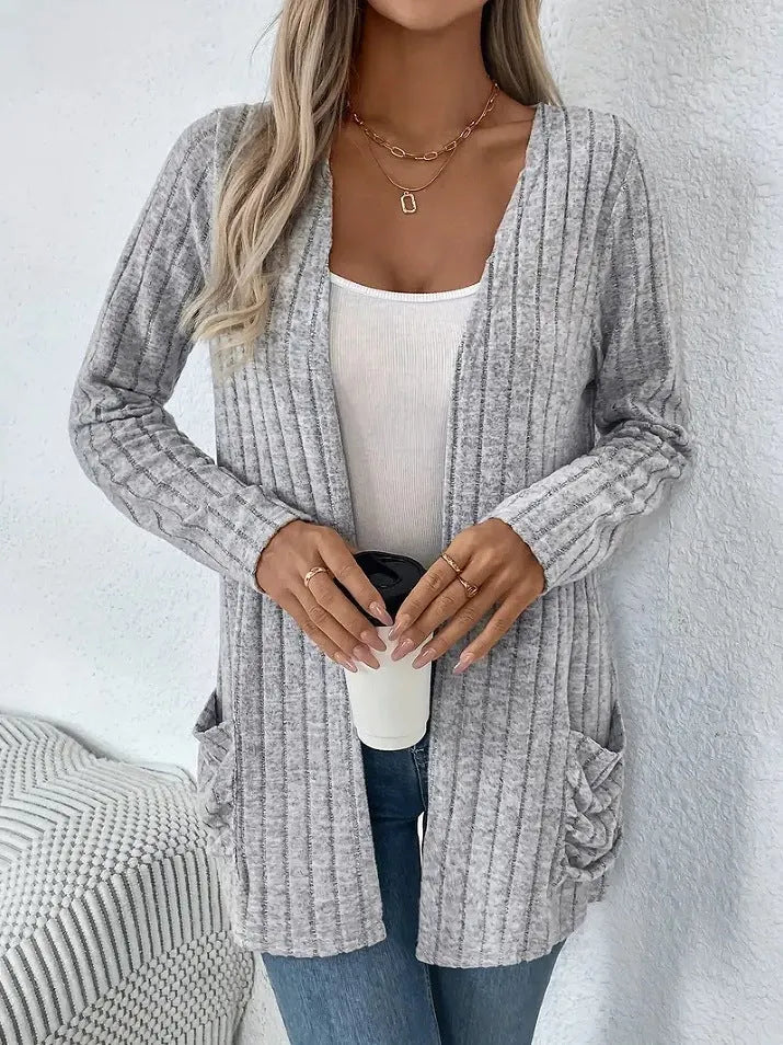 Solid colour long sleeve cardigan with front pockets, loose fit polyester knitwear