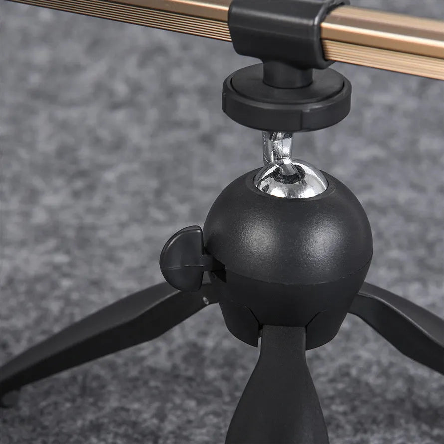 Aluminium ice fishing tripod rod holder bracket on ice.