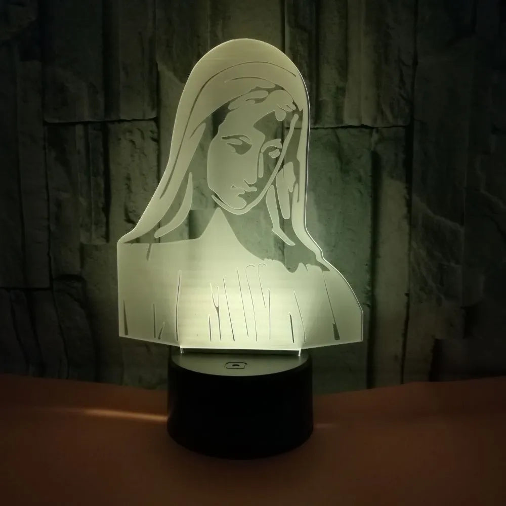 3D LED kids night light with colourful ring pattern, USB cable, and touch-sensitive base on a table.