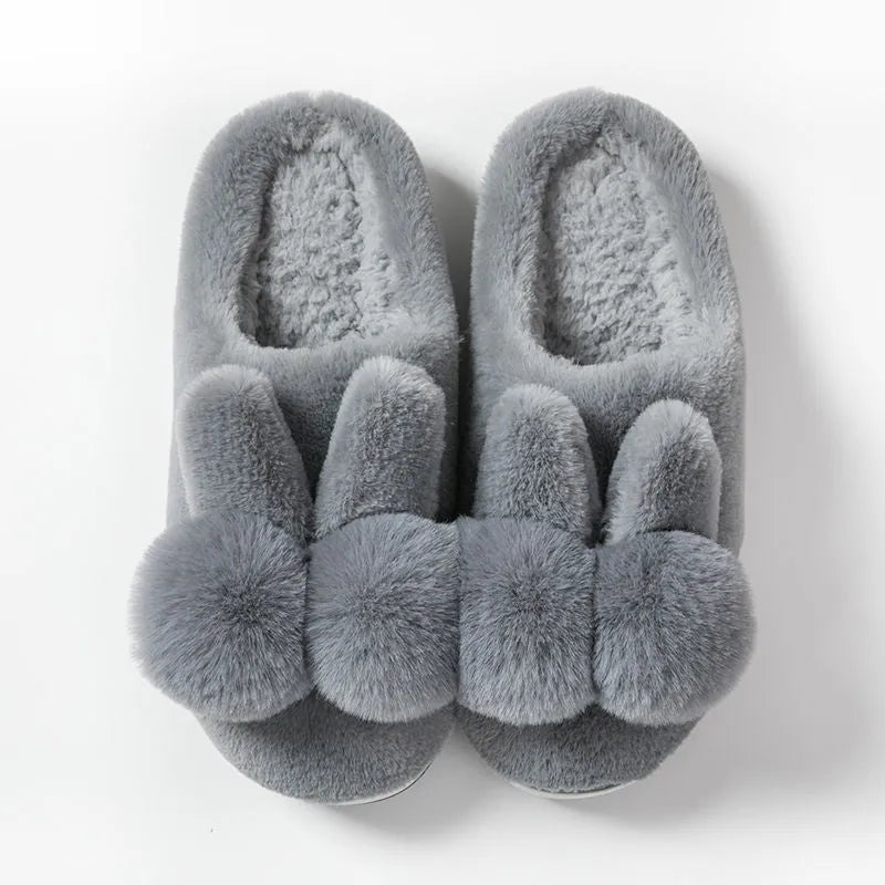 Women's bunny fluffy slippers in rabbit fur, shown in cream colour with floral detail and a sewn sole.