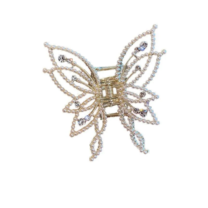 Women's butterfly-shaped alloy hair clip in rhinestone or pearl style, measuring 6.7 cm.