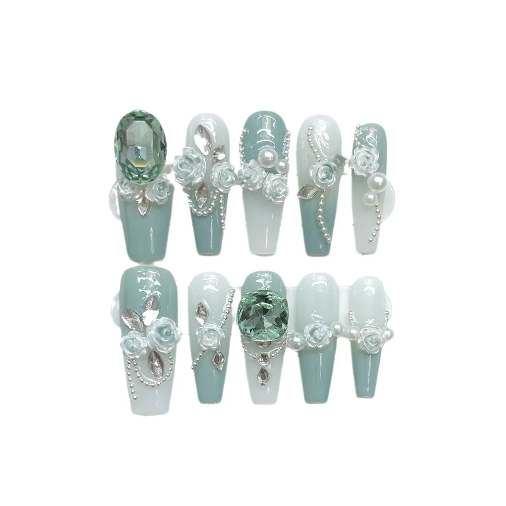 Camellia gradient nail art set with diamond chains, bow and butterfly patterns, and plastic armour suit