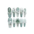 Camellia gradient nail art set with diamond chains, bow and butterfly patterns, and plastic armour suit