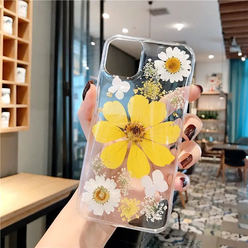 Floral patterned TPU phone case for iPhone in pink and yellow flower designs.