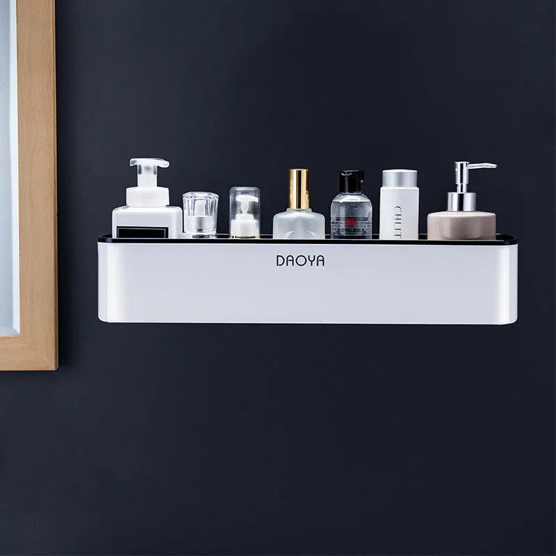 Hole-free plastic bathroom shelf wall mounted with shampoo and shower gel bottles in a tiled shower