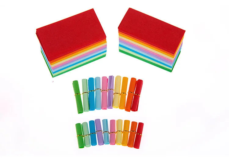 Assorted colour mini paper scrolls with metal eyelets in sizes 5x5cm, 3x7cm, 4x7cm, and 7x7cm for drift bottle messages.