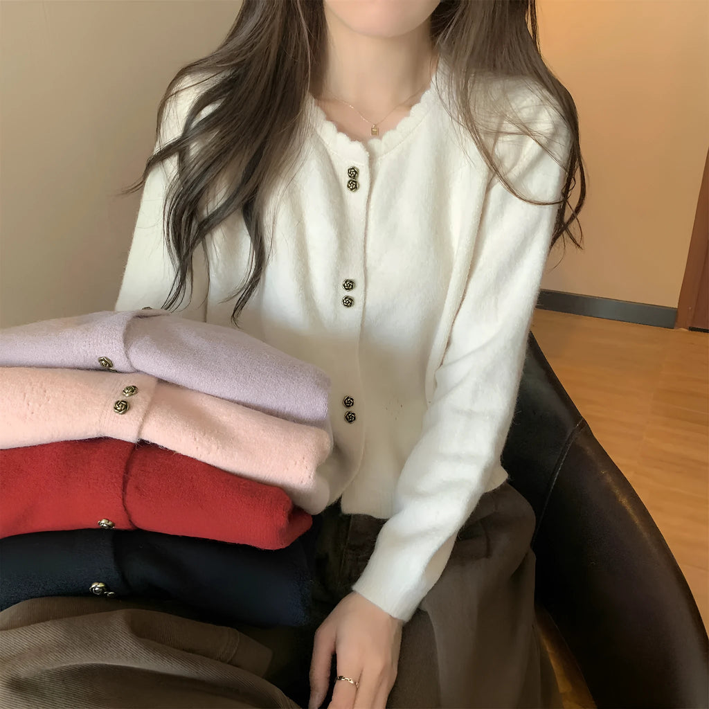 Women's long-sleeved acrylic cardigan coat in milky white, shown open as a lightweight knit layer.
