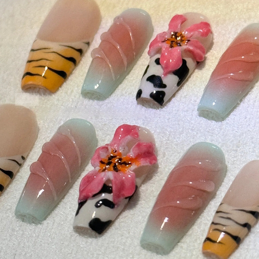 Lily hand carving acrylic nail art set featuring black and white zebra stripes with raised pink floral embossments.