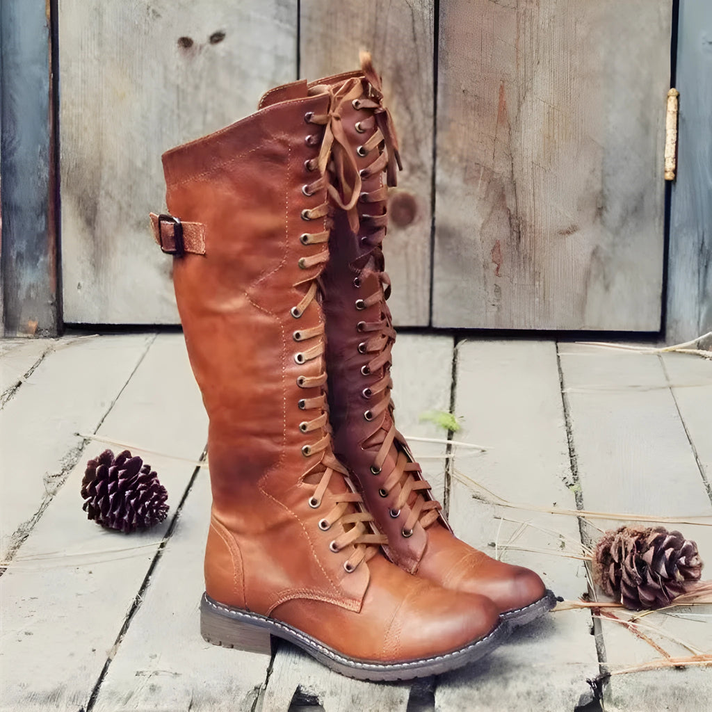 Women's black chunky heel high-leg casual boots with a round toe and rubber sole.