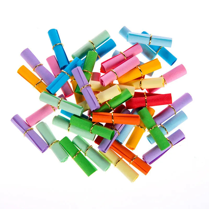 Assorted colour mini paper scrolls with metal eyelets in sizes 5x5cm, 3x7cm, 4x7cm, and 7x7cm for drift bottle messages.