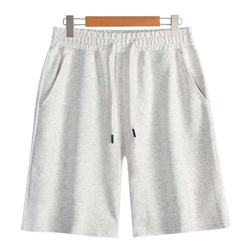 Men's straight-leg cotton sports shorts in light grey with an elastic waistband, laid flat.
