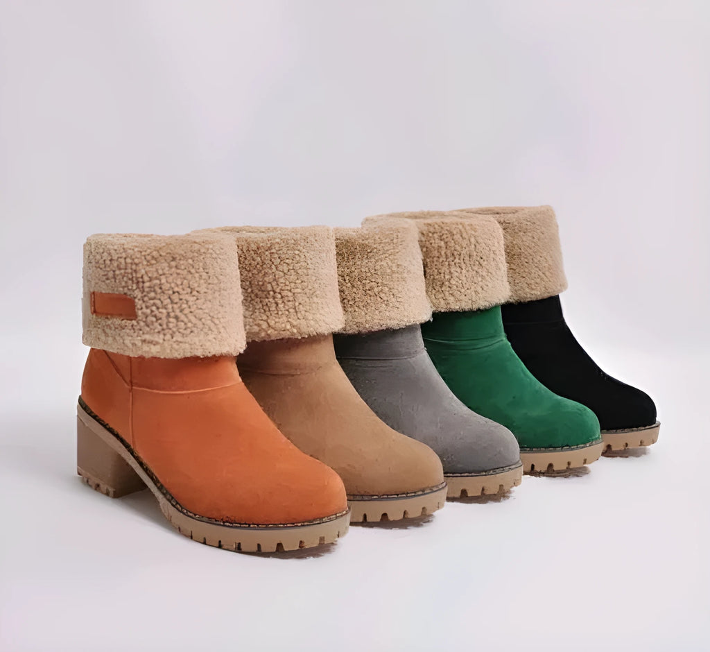 Women's mid-calf suede snow boots in various colours with a thick flat heel and round toe.