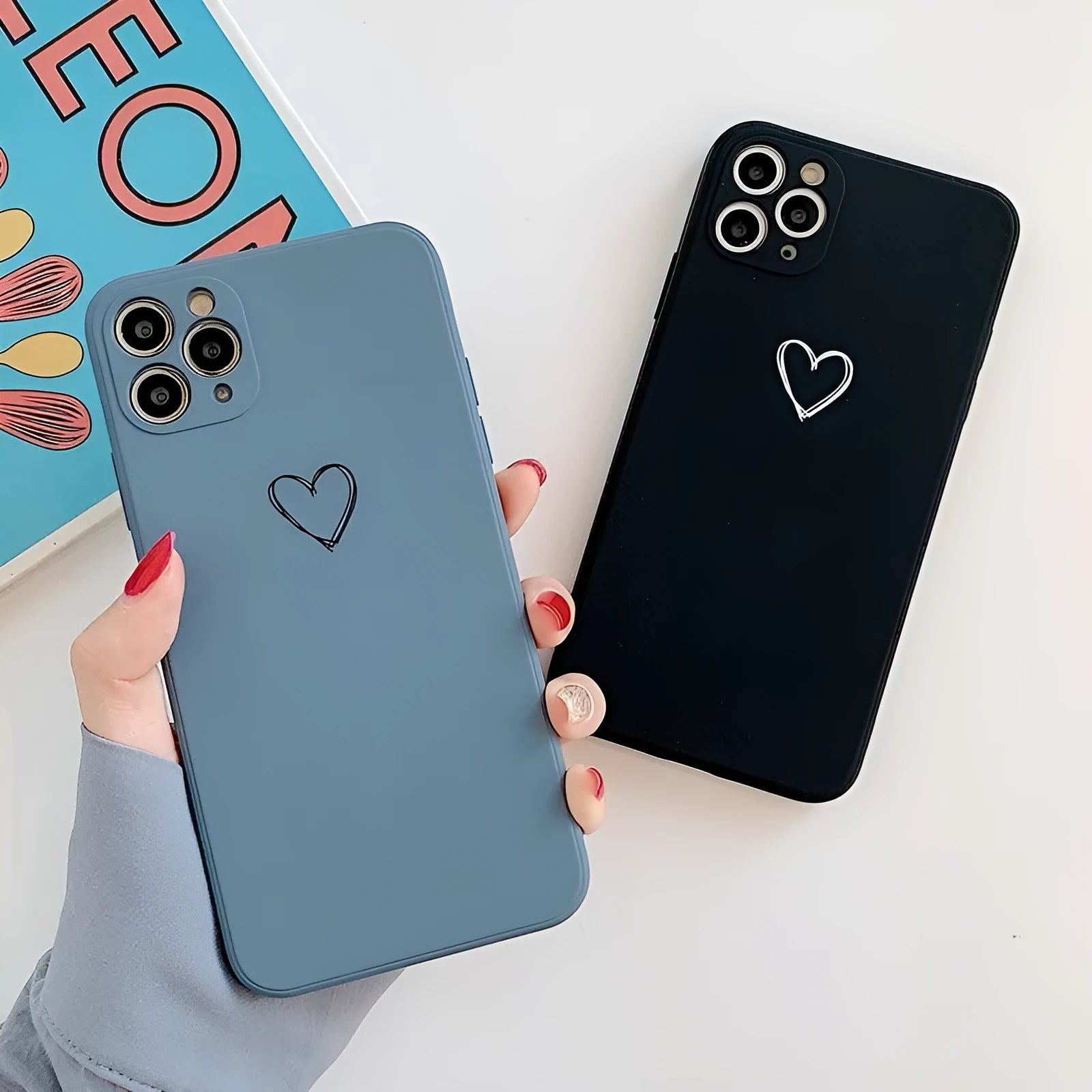 Solid colour silicone TPU back cover case for Apple iPhone on a table.