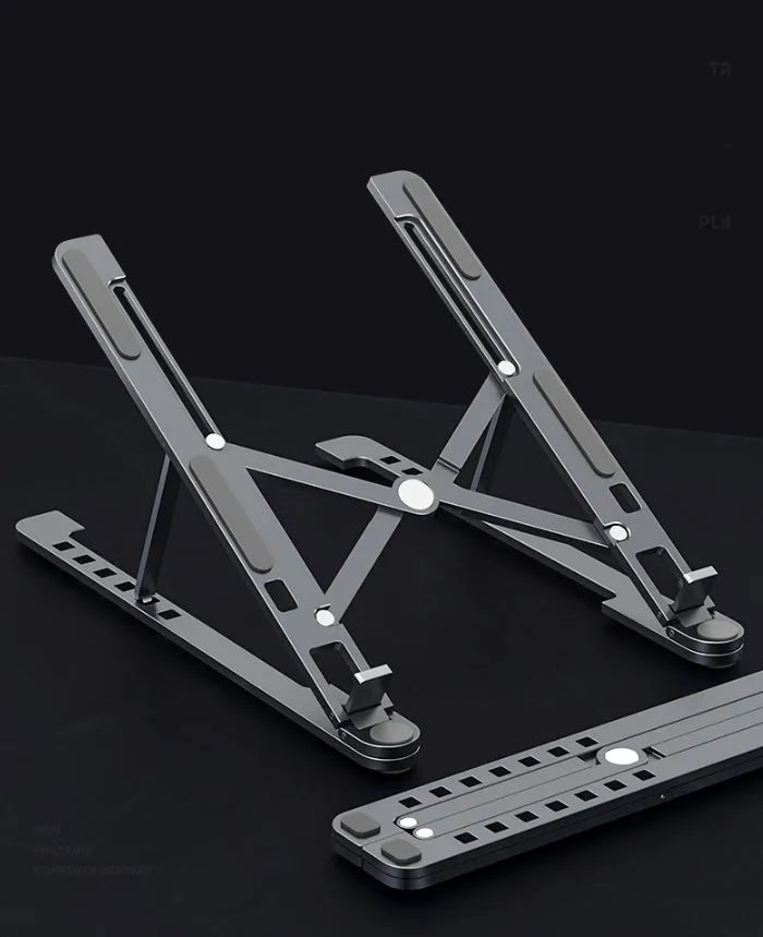Portable foldable aluminum laptop stand shown in silver colour at an adjustable angle