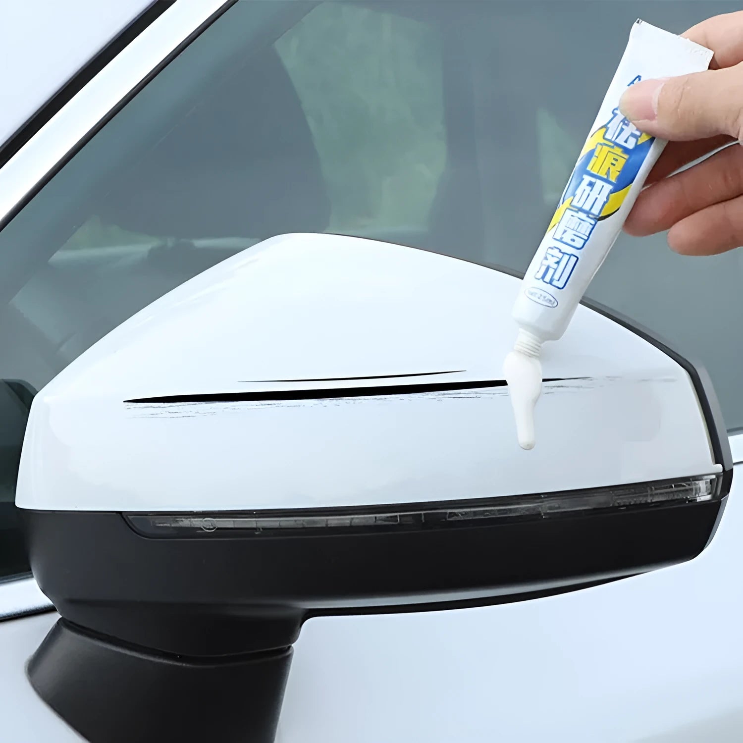 Automotive paint repair pen kit with touch-up paint, wax, sandpaper, and sponge for car scratches