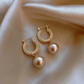 Geometric copper zircon earrings with rose design elements in multiple colour variations
