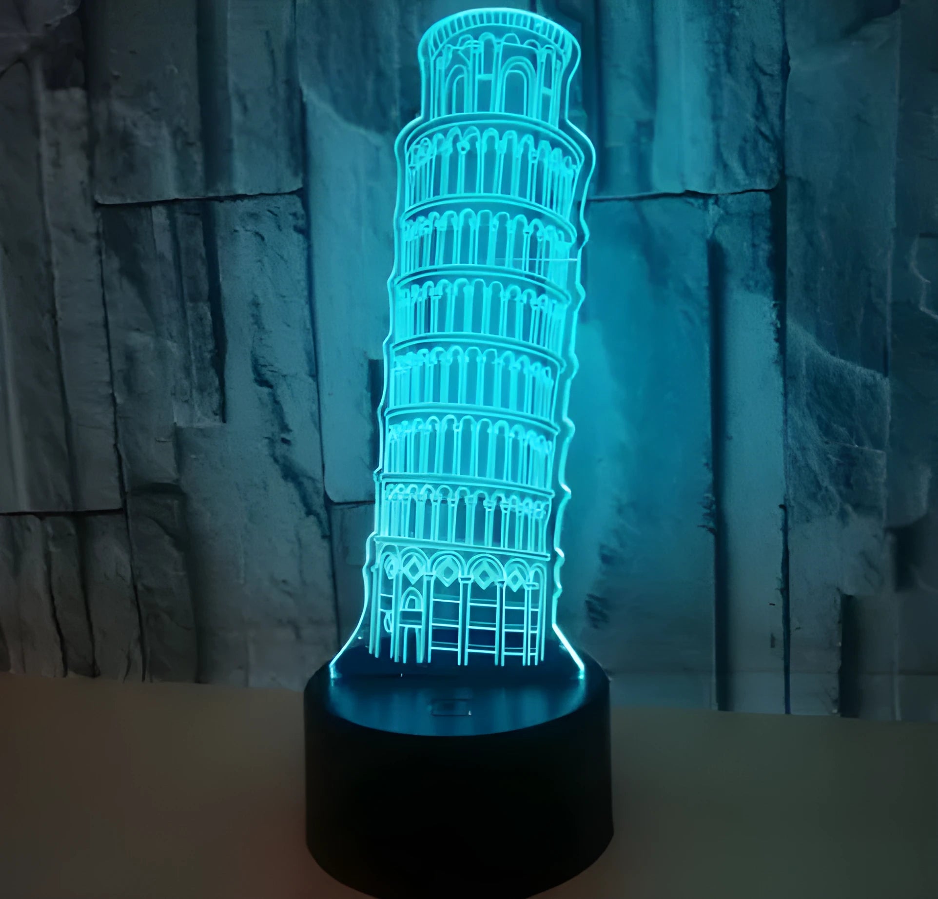 Leaning Tower of Pisa 3D acrylic night light illuminating in multiple colours on a desk