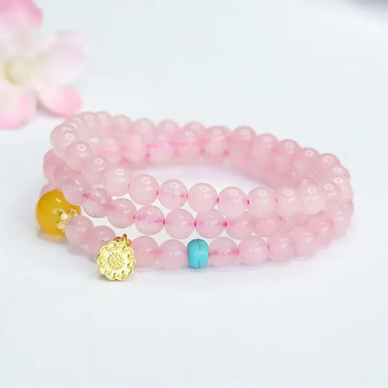 Pink artificial crystal multi-circle bracelet featuring classic Pi Xiu design on white background
