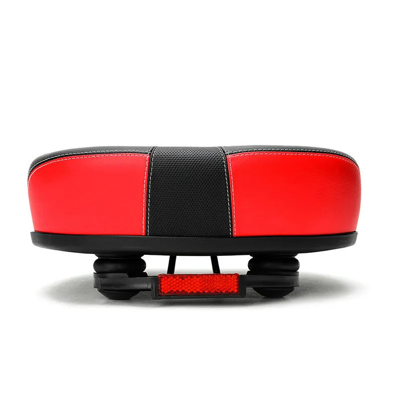 Thickened plus size mountain bike saddle in red, grey, or light brown with shock absorber and reflective stickers.