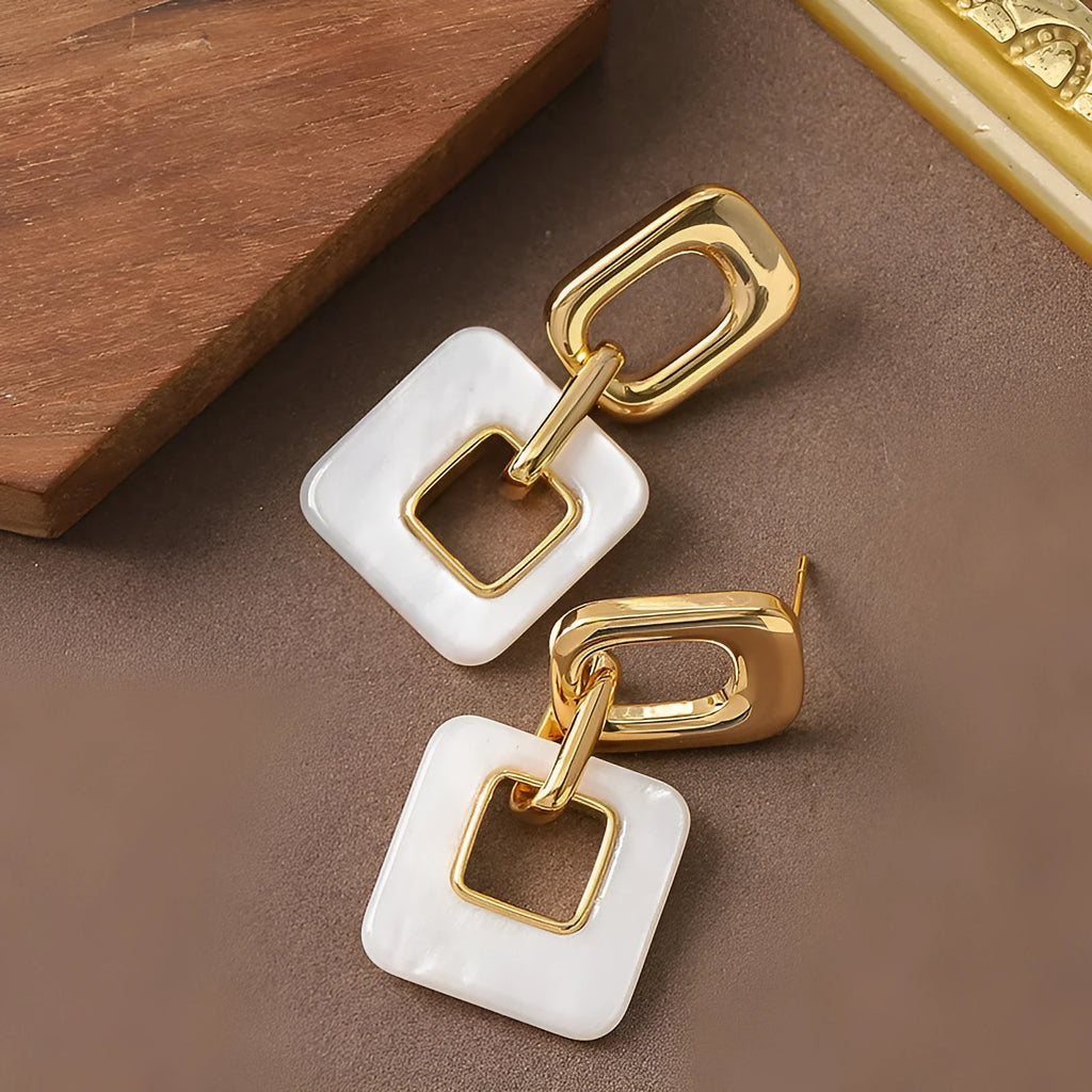Copper hollow geometric square earrings with electroplated finish, chamfered corners, and two colour options
