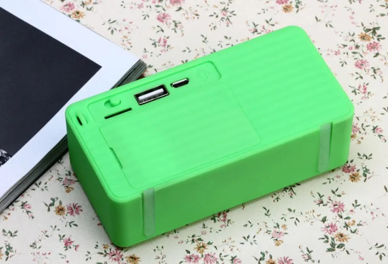 Cannon X3 small cube-shaped wireless Bluetooth speaker in black, blue, green, red, or yellow colour.