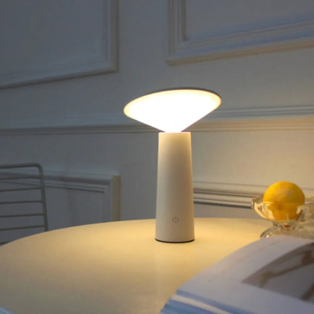 Black USB touch control desk lamp with adjustable head on a wooden desk