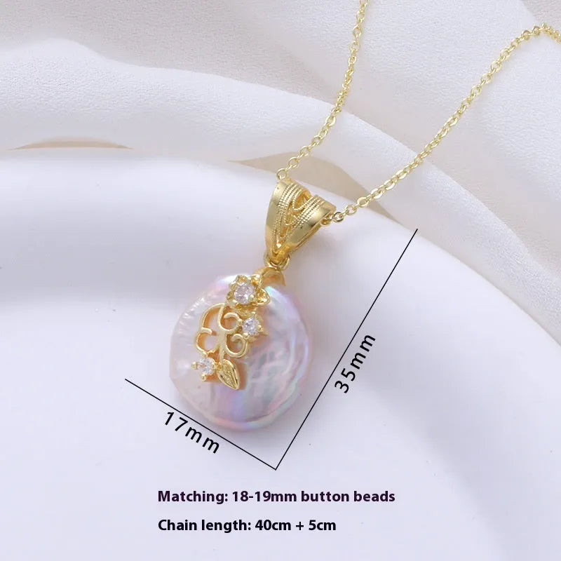 Women's matching baroque pearl geometry necklace with O-ring chain and earring set on display