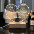 Custom acrylic LED night light with personalised names and dates illuminated