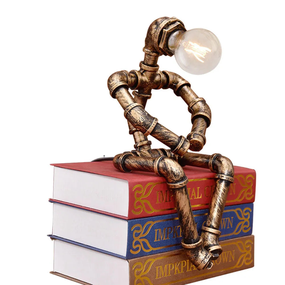 Green bronze industrial desk lamp with iron pipe design on wooden table