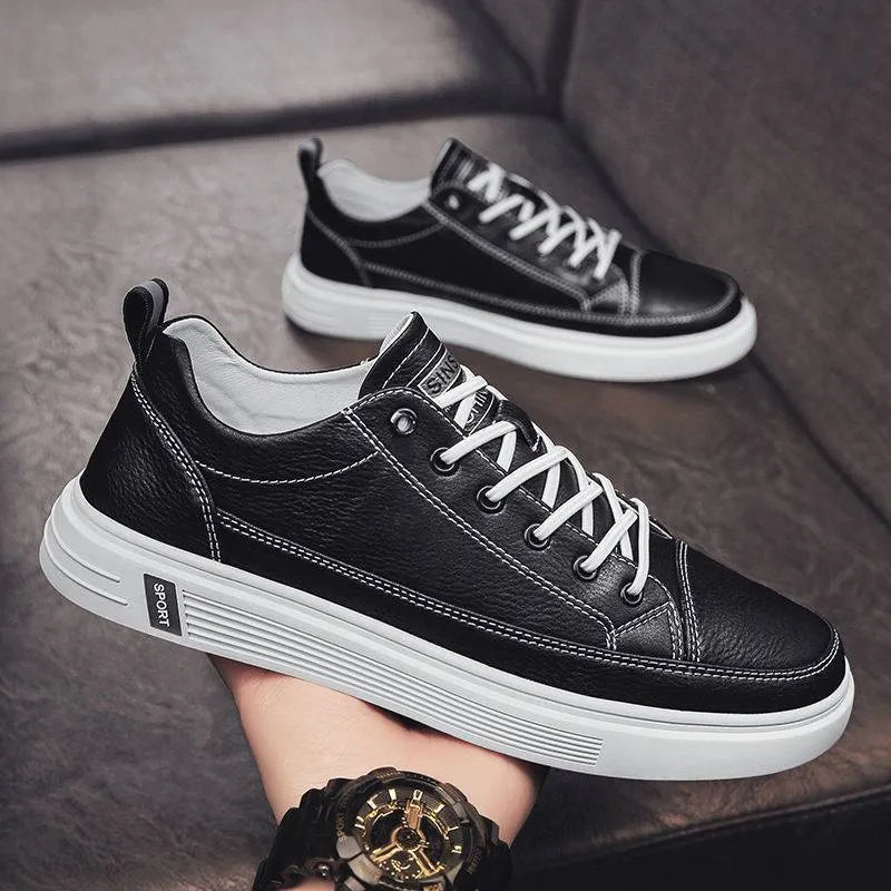Men's white casual summer shoes with round toe and flat low heel on a plain background.