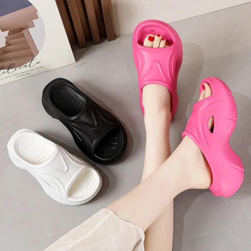 Women's thick-soled EVA slippers in rose red colour with round toe.