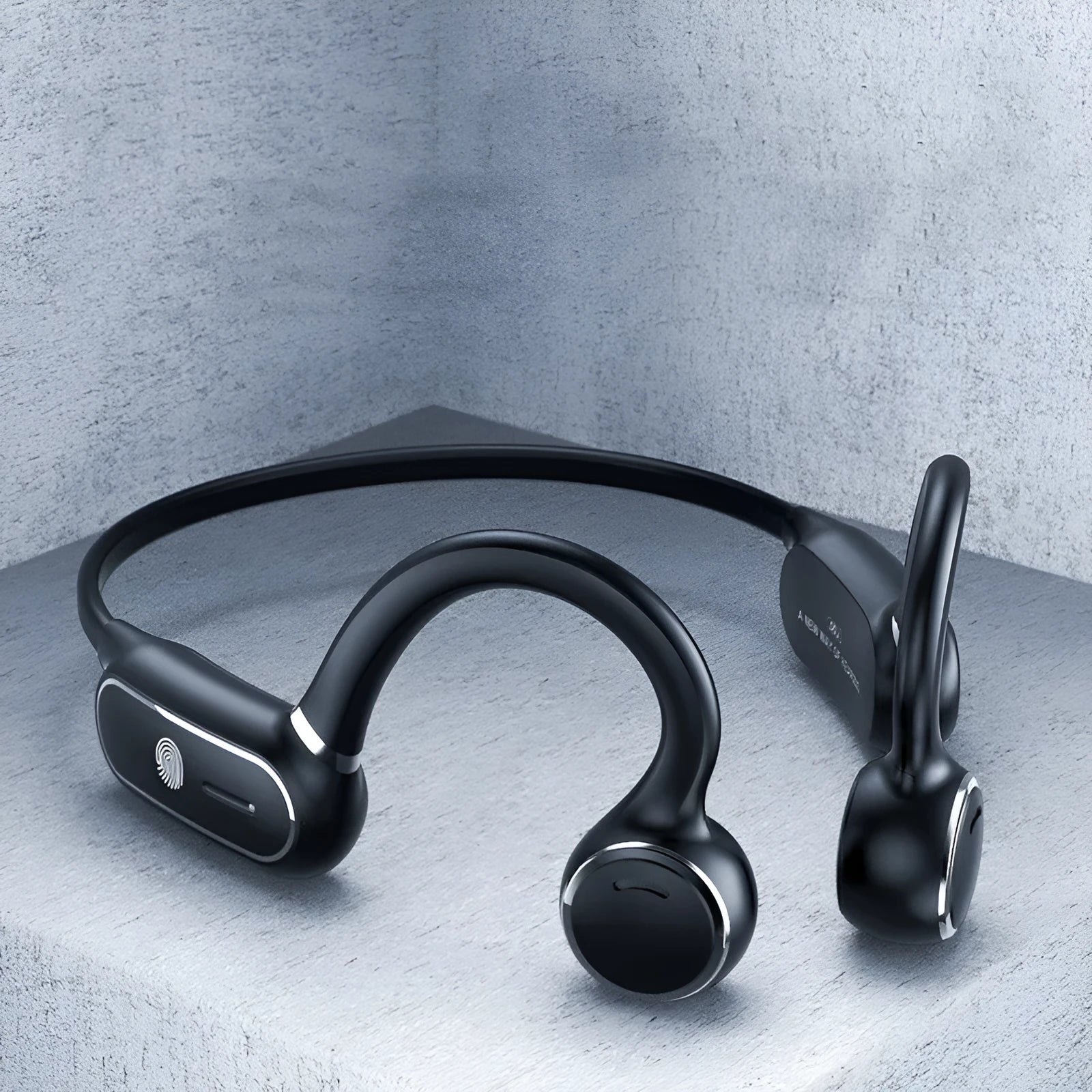 Black air conduction wireless earphone with ear-hooking design and touch controls.