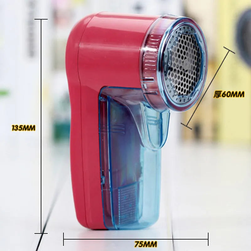 Portable electric clothing lint remover showing compact white body and shaving head