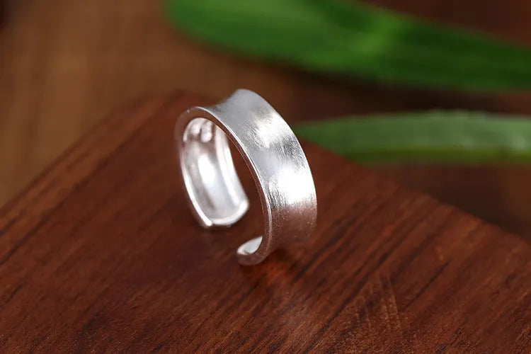 Geometric open ring with frosted silver finish and adjustable opening design