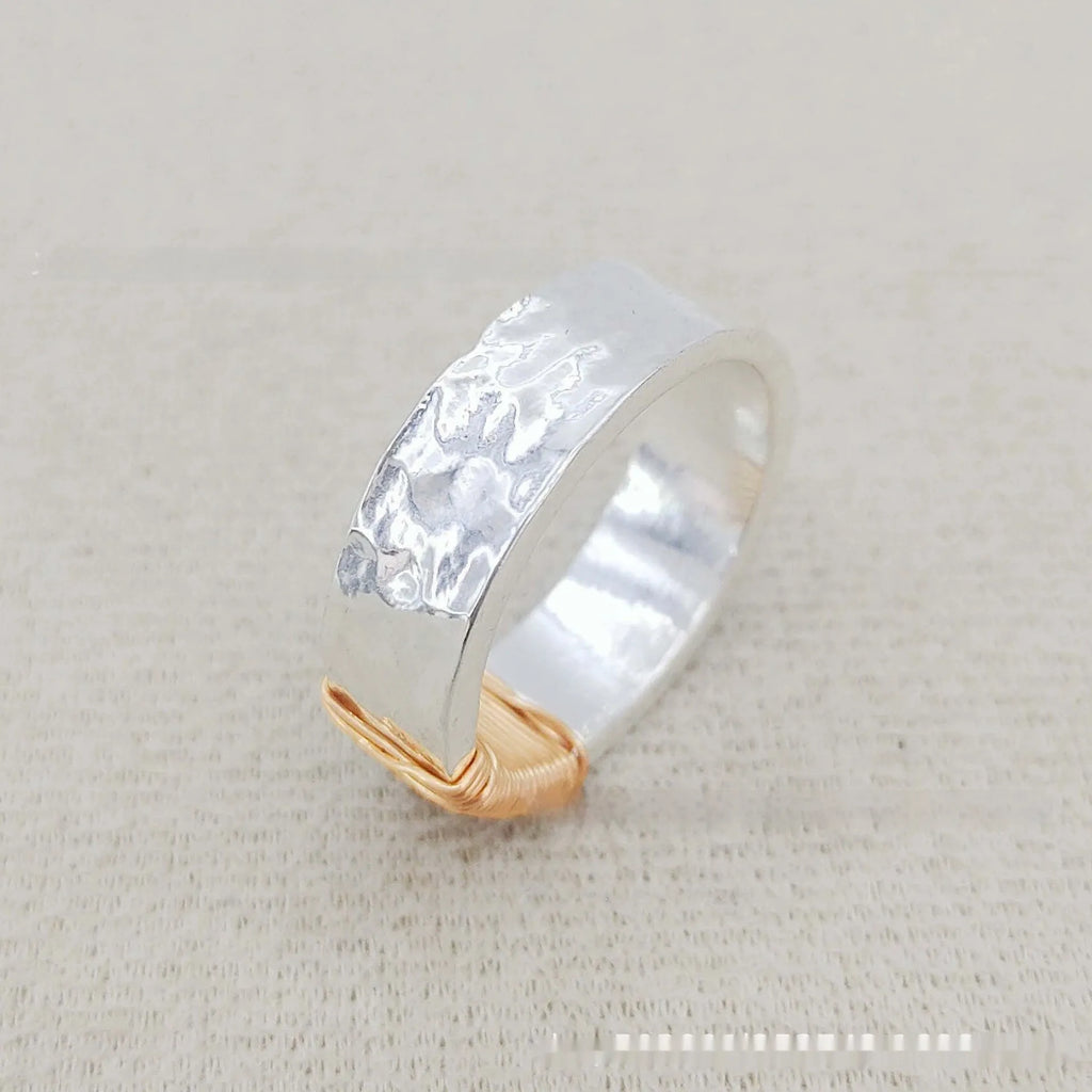 Copper geometric bracelet with irregular coil design in electroplated silver gold colour