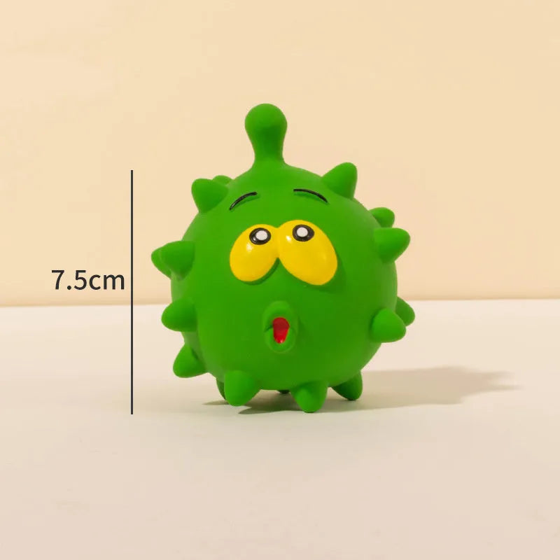 Set of four colourful latex squeaky dog balls with cute faces and textured surfaces.