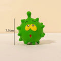 Set of four colourful latex squeaky dog balls with cute faces and textured surfaces.