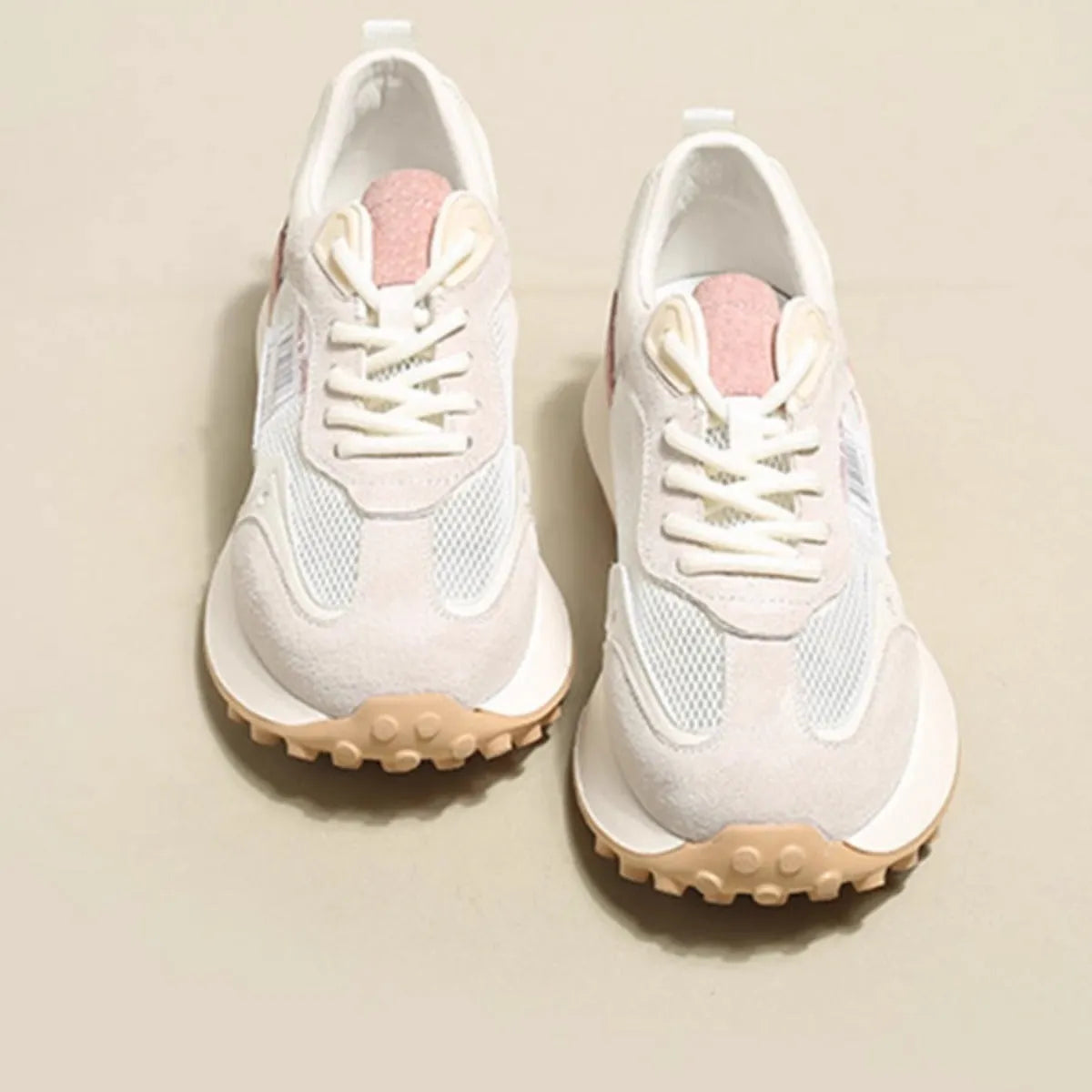 Women's grey and pink retro sneakers with low-top design and round toe