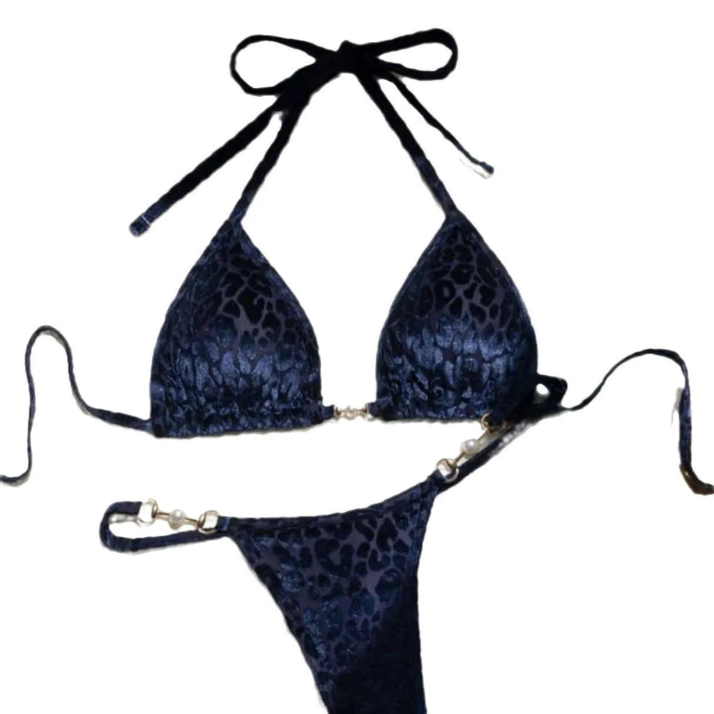 Women's blue leopard print bikini set on a yellow background, showing triangle top and briefs style.