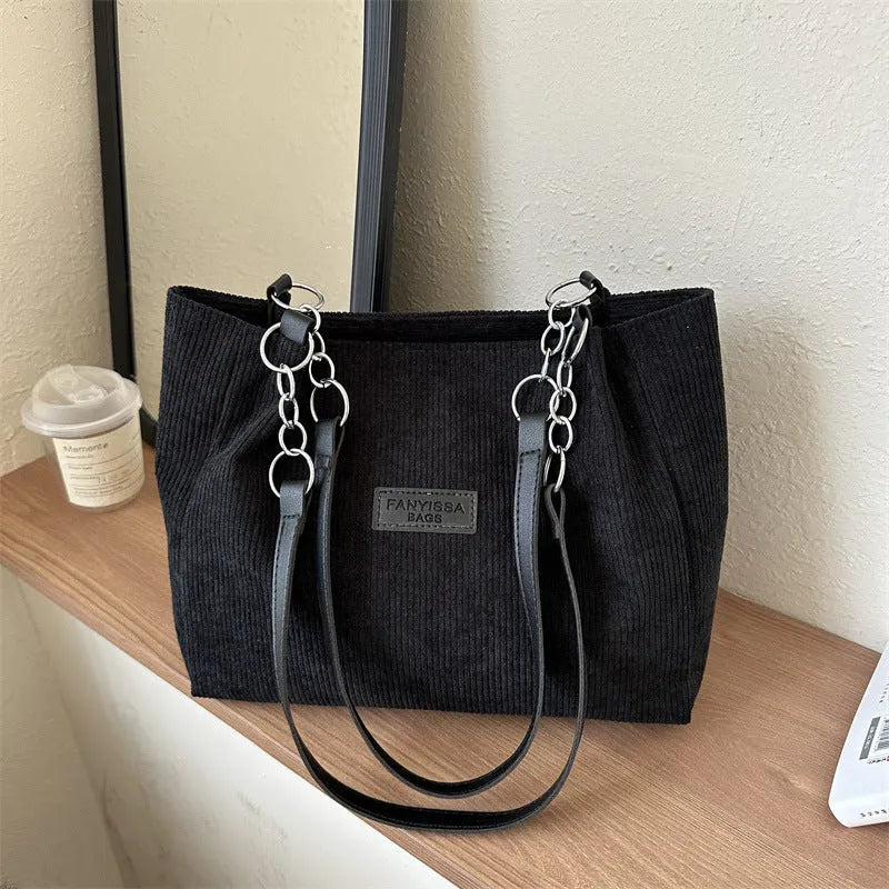 Corduroy one-shoulder large capacity tote handbag for women in black, brown, and white with outer pocket