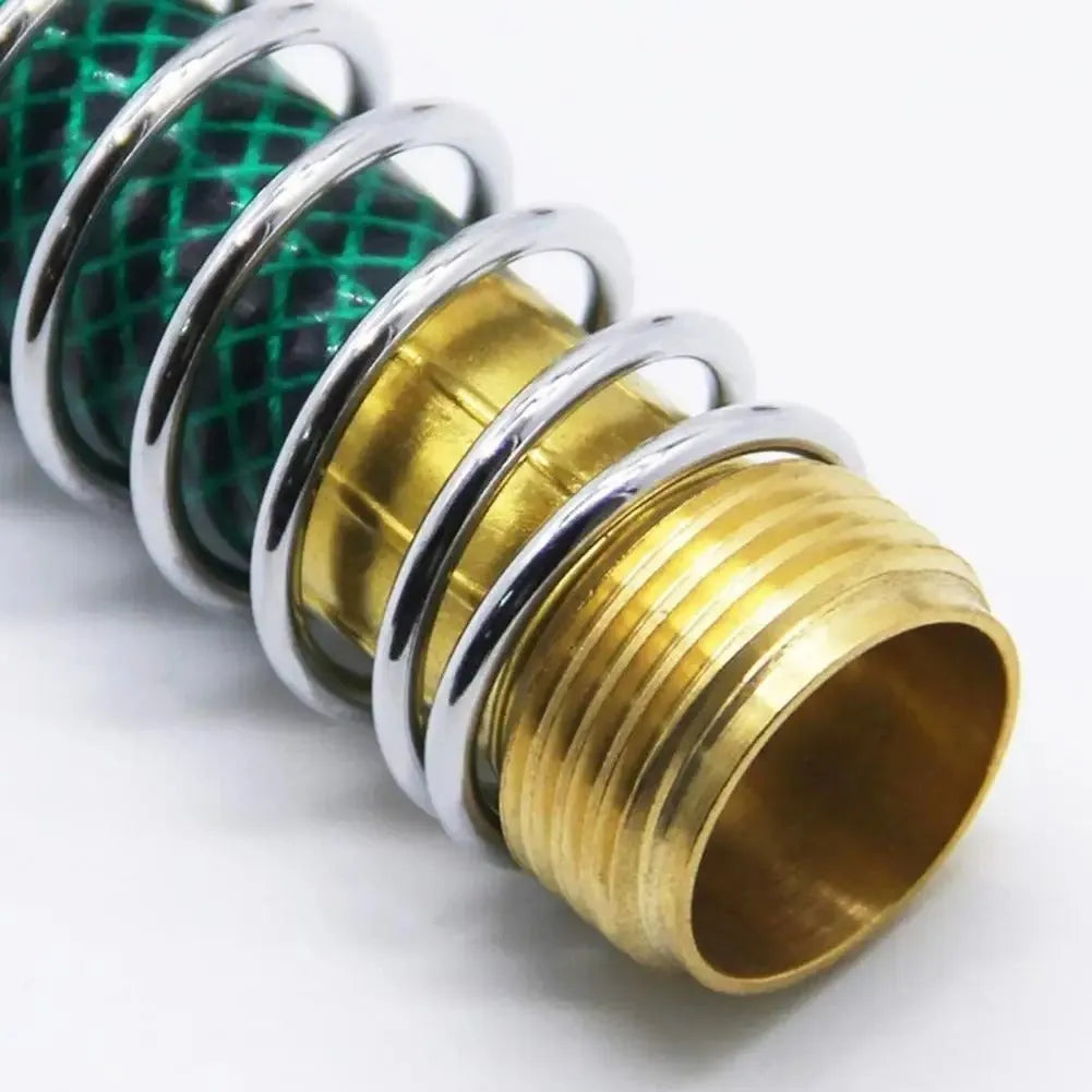Brass garden hose connector with a coiled spring and 3/4 inch threaded ends on a white background.
