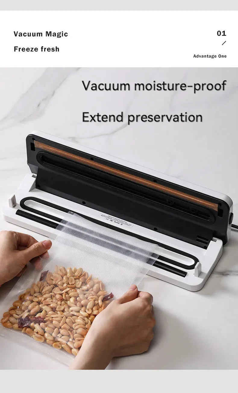 White automatic vacuum sealer machine for household food preservation on a kitchen counter.