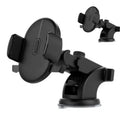 Black telescopic arm car phone holder with suction cup mount on a dashboard.