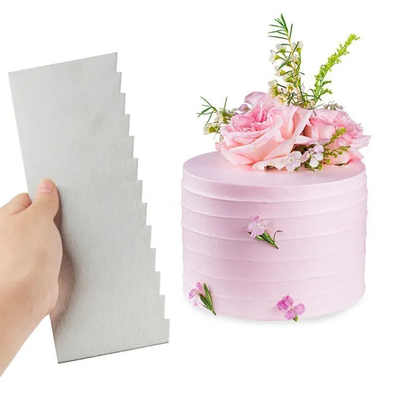 Stainless steel cream scraper with a polygonal patterned edge for cake decorating.