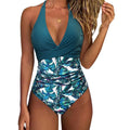 Women's printed one-piece bikini swimsuit with lace-up back in leopard print and floral patterns.