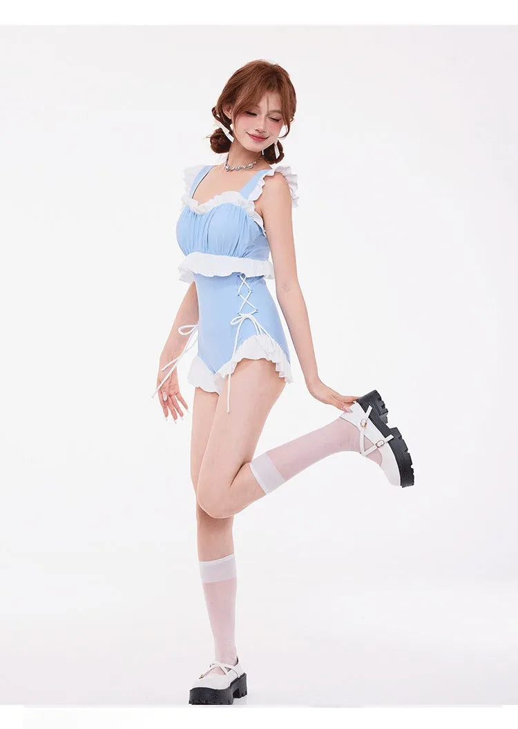 Light blue women's high-waist one-piece swimsuit with lace gather detail on chest and backless design.